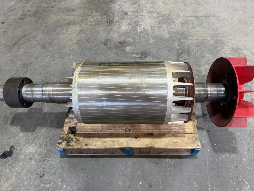 CNC QLD technician performing mechanical overhaul on equipment.